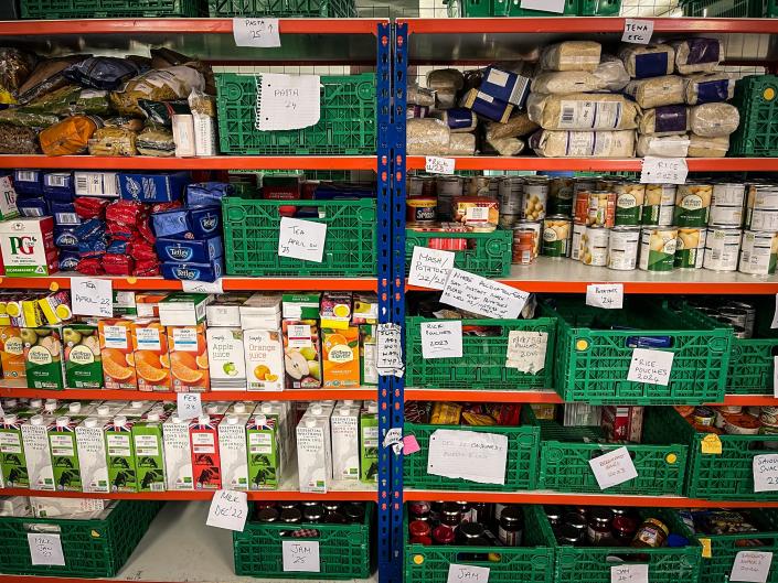 Donated food is seen stored on shelves inside a food bank, on May 15, 2022 in Bristol, England