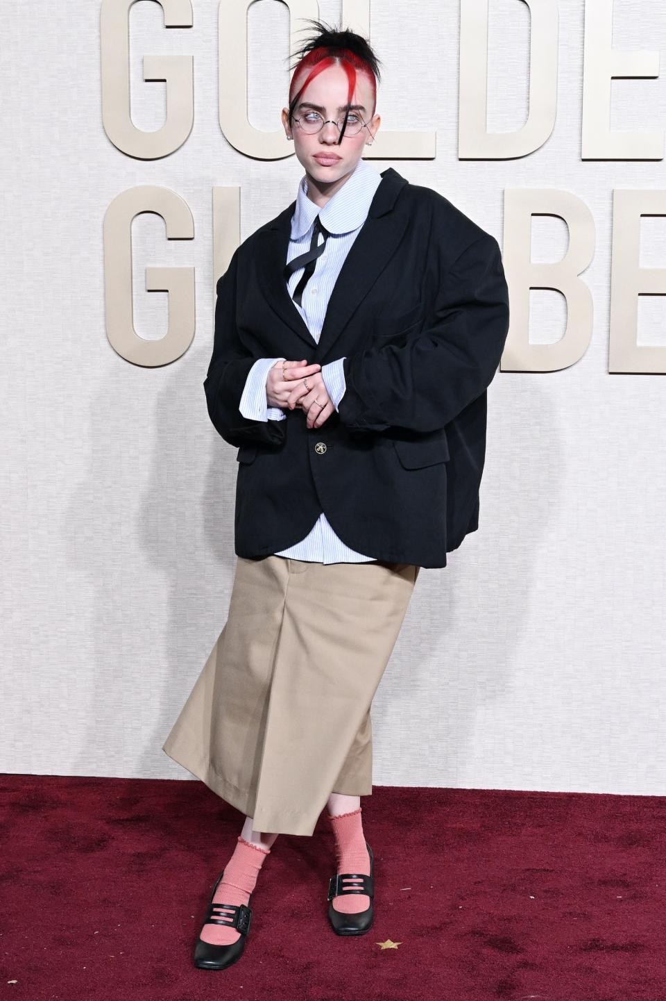 Billie Eilish, heels, high heels, Mary Janes, Mary Jane shoes, Mary Jane heels, black heels, black Mary Janes, buckle Mary Janes, Willy Chavarria, Willy Chavarria spring 2024, blazer, navy blazer, shorts, socks, pink socks, Golden Globe Awards, Golden Globes, red carpet, celebrity red carpet, awards