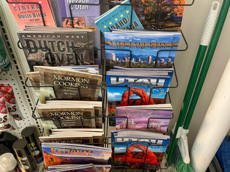 A display of Utah guides at a gas station.