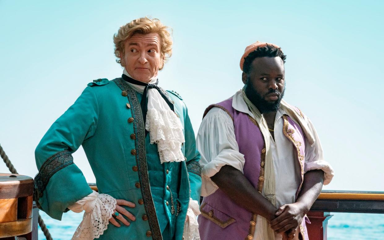 Rhys Darby stars as pirate Stede Bonnet and Samson Kayo as crewmate Oluwande Boodhari in Our Flag Means Death - Jake Giles Netter