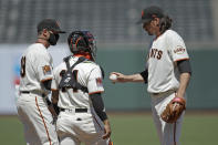 San Francisco Giants' Jeff Samardzija, right, hands the ball to manager Gabe Kapler as he is removed in the sixth inning of a baseball game against the Texas Rangers Sunday, Aug. 2, 2020, in San Francisco. (AP Photo/Ben Margot)