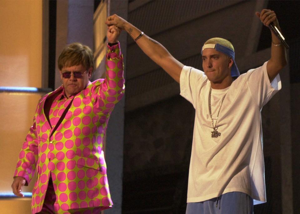 Elton John, left, and Eminem appear together after performing a duet near the end of the 43rd annual Grammy Awards Wednesday Feb. 21, 2001, at the Staples Center in Los Angeles. (AP Photo/Kevork Djansezian)