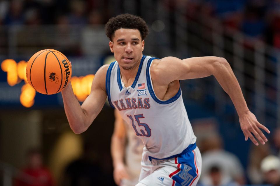 Kansas Jayhawks guard Kevin McCullar Jr. (15) dribbles down the court during the second half of an NCAA college basketball game Tuesday, Dec. 5, 2023, at Allen Fieldhouse.