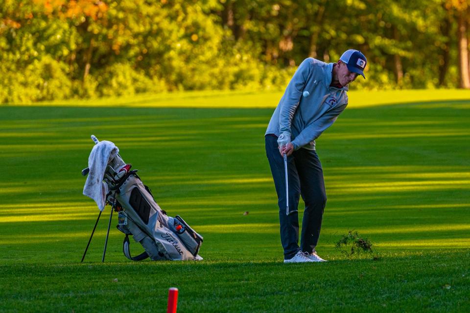 Bishop Stang's Matthew Costello chips to the green on Hole 6.