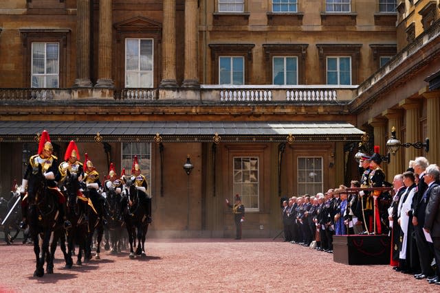 The King and the Princess Royal take the salute