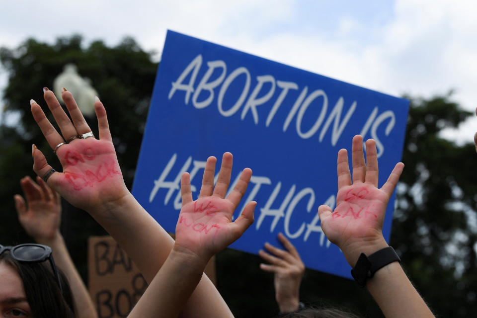 Abortion rights supporters demonstrate outside the United States Supreme Court as the court rules in the Dobbs v Women's Health Organization abortion case, overturning the landmark Roe v Wade abortion decision in Washington, U.S.,  June 24, 2022. REUTERS/Mary F. Calvert