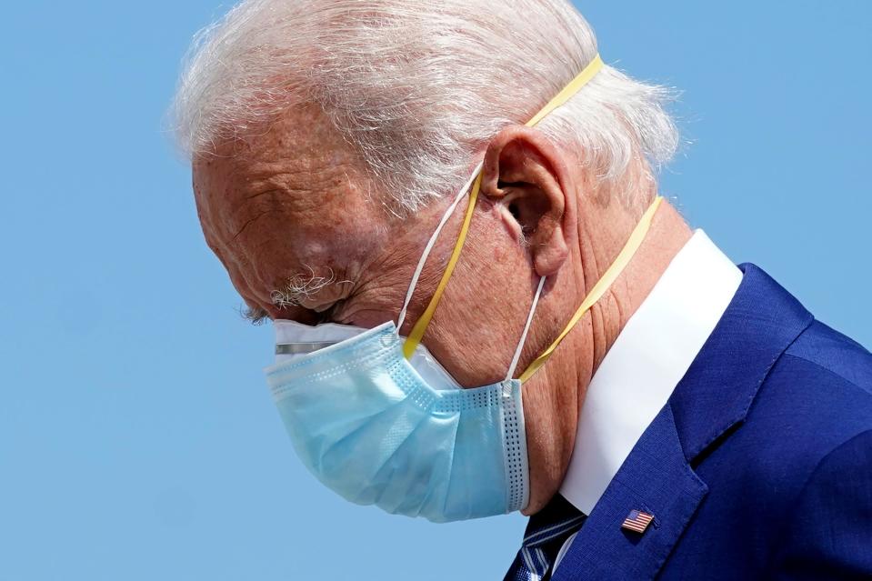 Democratic presidential candidate former Vice President Joe Biden wears two face masks as he arrives at Fort Lauderdale-Hollywood International Airport, in Fort Lauderdale, Fla., Tuesday Oct. 13, 2020.