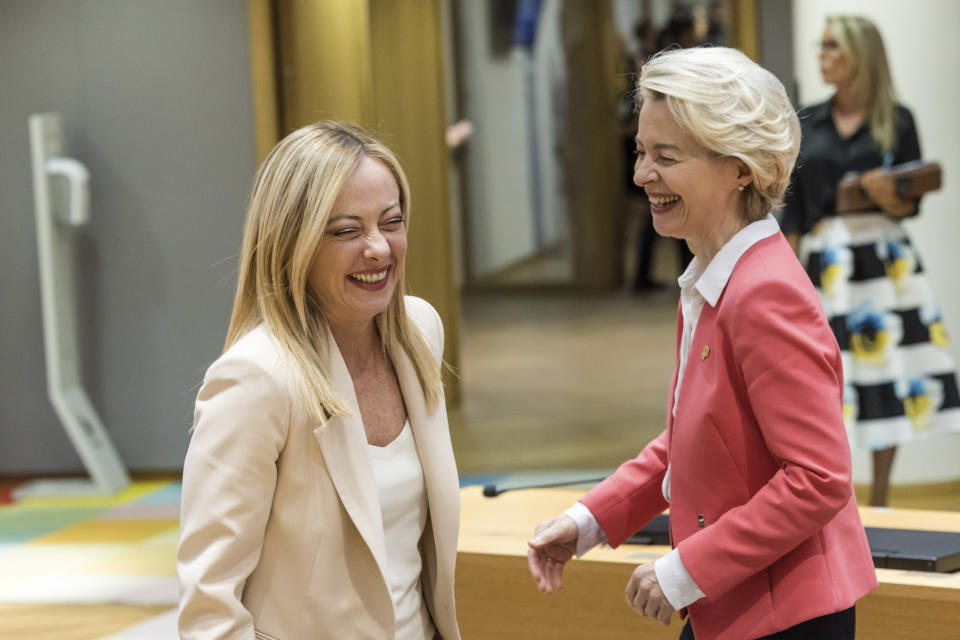 FILE - Italy's Premier Giorgia Meloni, left, greets European Commission President Ursula von der Leyen during a round table meeting at an EU summit in Brussels, Thursday, June 29, 2023. Meloni's popularity is expected to ensure significant gains for her far-right Brothers of Italy Party in June's European Parliamentary elections, and European Commission President Ursula Von der Leyen, who has exhibited a liking for Meloni, has already floated the notion of bringing her into a coalition if needed. (AP Photo/Geert Vanden Wijngaert, File)