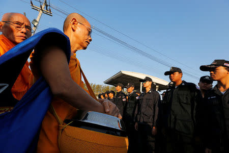 Thai police block Buddhist monks at the gate of Dhammakaya temple in Pathum Thani province, Thailand February 16, 2017. REUTERS/Jorge Silva