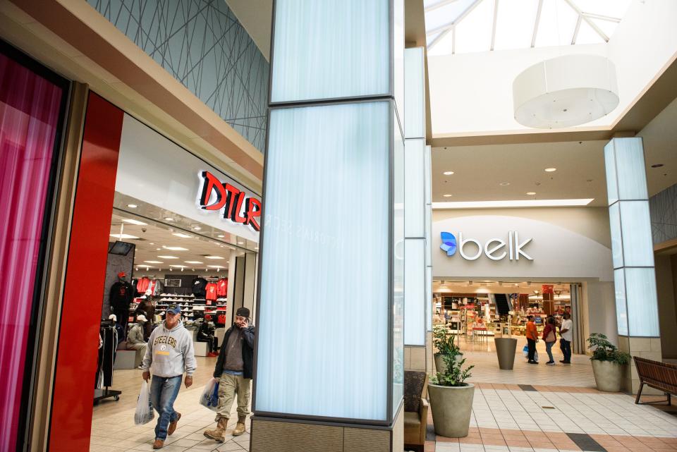 Shoppers make their way through the Cross Creek Mall on Tuesday, Dec. 12, 2023.