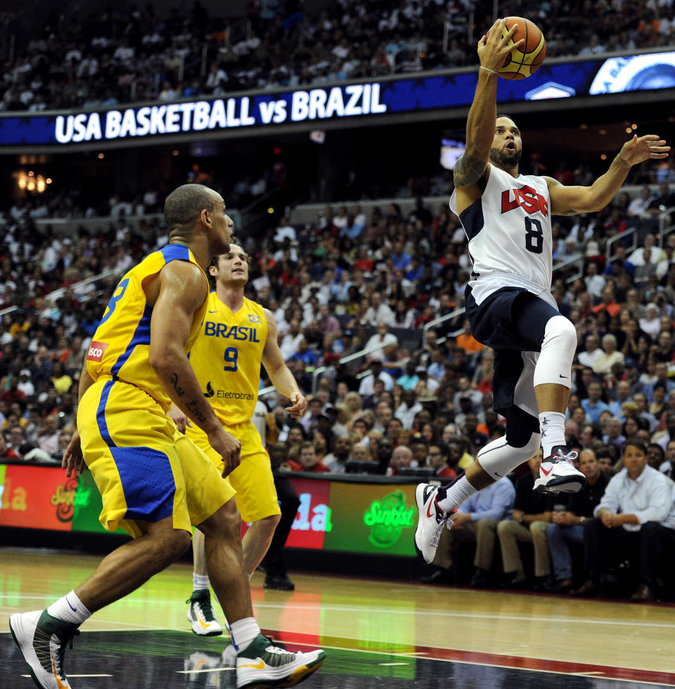 WASHINGTON, DC - JULY 16: Deron Williams #8 of the US Men's Senior National Team drives to the hoop past Brazil in the first quarter during a pre-Olympic exhibition basketball game at the Verizon Center on July 16, 2012 in Washington, DC. (Photo by Patrick Smith/Getty Images)