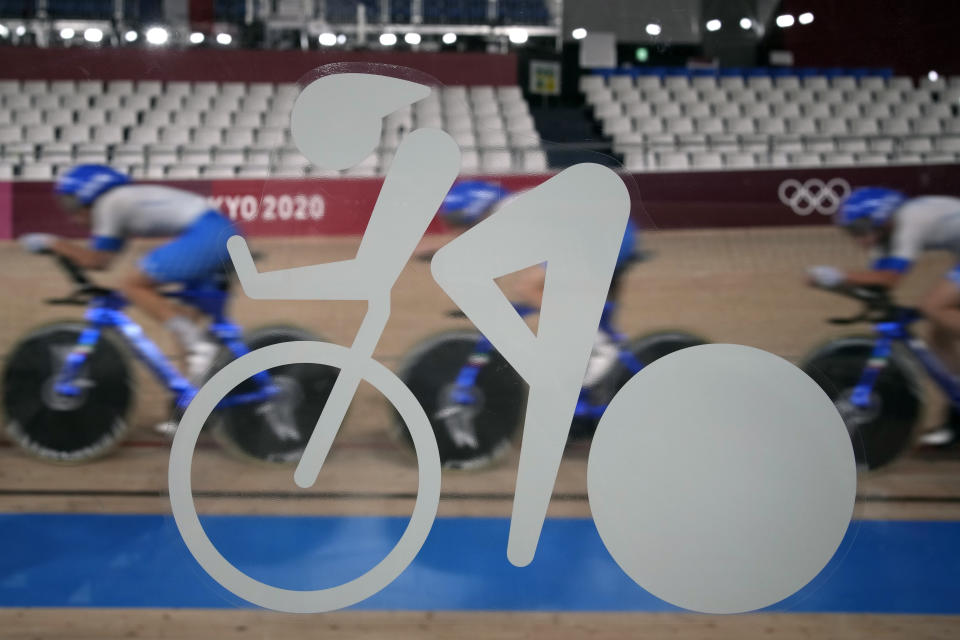 Members of the Italian men's track cycling team round the track during a training session inside the Izu velodrome at the 2020 Summer Olympics, Thursday, July 29, 2021, in Tokyo, Japan. (AP Photo/Christophe Ena)