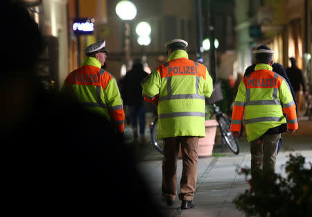 Police patrol near the entrance of the Christmas market in Regensburg, Germany, November 27, 2017. REUTERS/Michael Dalder