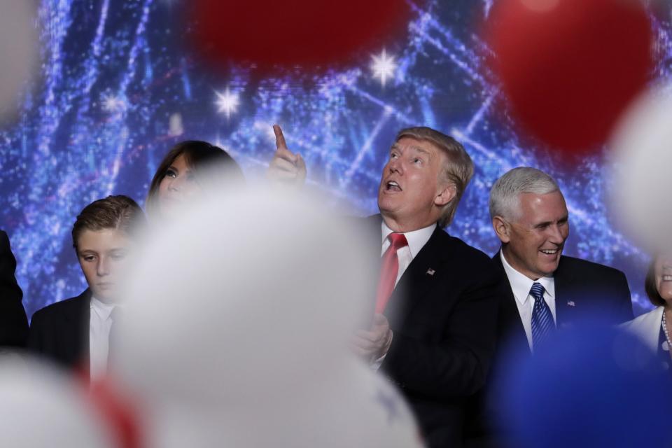 Donald Trump lwith his son Barron, wife Melania, and Republican vice presidential nominee Gov. Mike Pence after delivering his acceptance speech at the Republican National Convention in Cleveland, July 21, 2016. (Photo: J. Scott Applewhite/AP)