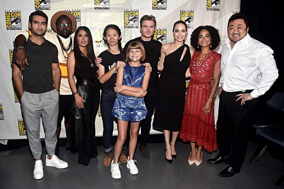 Kumail Nanjiani, Brian Tyree Henry, Salma Hayek, Director Chloe Zhao, Lia McHugh, Richard Madden, Angelina Jolie, Lauren Ridloff and Don Lee of Marvel Studios' 'The Eternals' at the San Diego Comic-Con International 2019 Marvel Studios Panel in Hall H on July 20, 2019 in San Diego, California