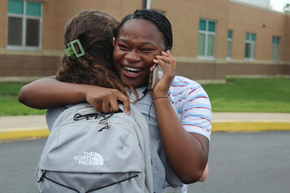 Student Kendra Allen and her classmates celebrate in the auditorium of Chillicothe High School after she won a new car from Herrnstein Auto as part of the Keys to Success program on May 8, 2023. Allen called her mom to tell her the news.