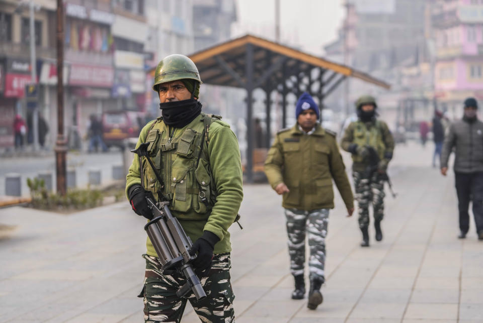 Indian paramilitary soldiers patrol at the main market in Srinagar, Indian controlled Kashmir, Monday, Dec. 11, 2023. India’s top court on Monday upheld a 2019 decision by Prime Minister Narendra Modi’s government to strip disputed Jammu and Kashmir’s special status as a semi-autonomous region with a separate constitution and inherited protections on land and jobs. (AP Photo/Mukhtar Khan)