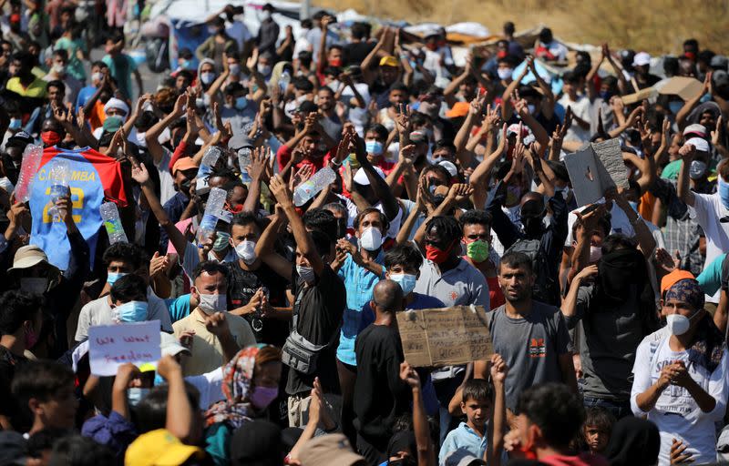 Refugees and migrants from the destroyed Moria camp protest on the island of Lesbos