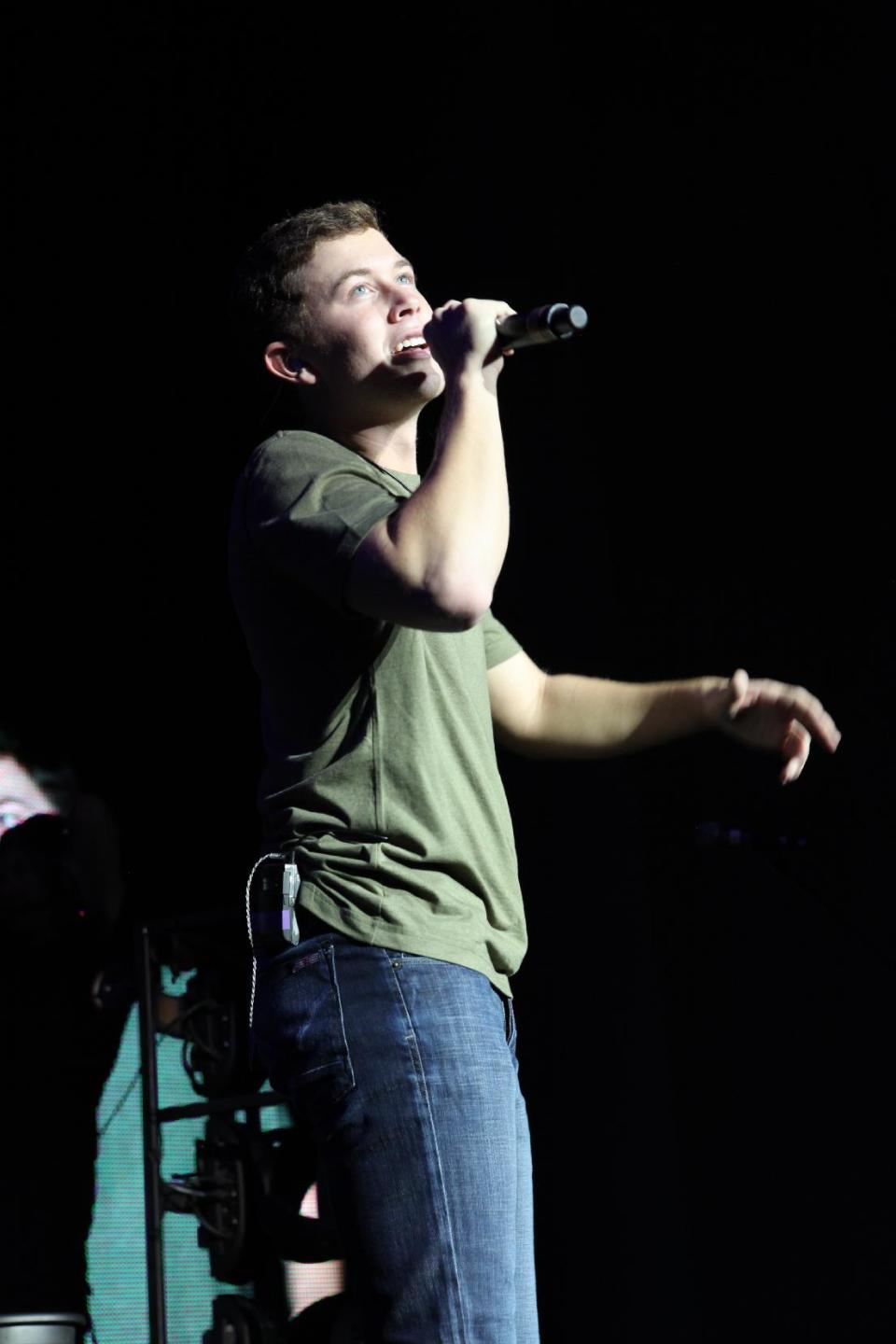 FILE - In this Sept. 15, 2012 file photo, Scotty McCreery performs at Aarons Amphitheater in Atlanta. McCreery rode a wave of success after winning the 2011 season of “American Idol,” with his first record going platinum and winning several new artist awards. But with his sophomore album, “See You Tonight,” McCreery says his career is now in his hands alone. (Photo by Robb Cohen/RobbsPhotos/Invision/AP, File)
