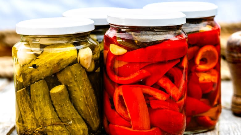 Glass jars of pickled vegetables 