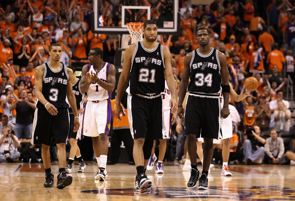 <p>2010: George Hill #3, Tim Duncan #21 and Antonio McDyess #34 of the San Antonio Spurs react as Amar'e Stoudemire #1 and the Phoenix Suns celebrate in the final moments of Game One of the Western Conference Semifinals of the 2010 NBA Playoffs at US Airways Center on May 3, 2010 in Phoenix, Arizona.</p>