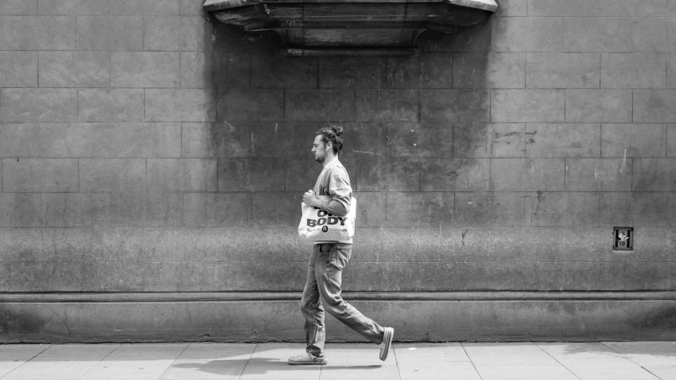 Leica M11 Monochrom image example showing man walking on sidewalk