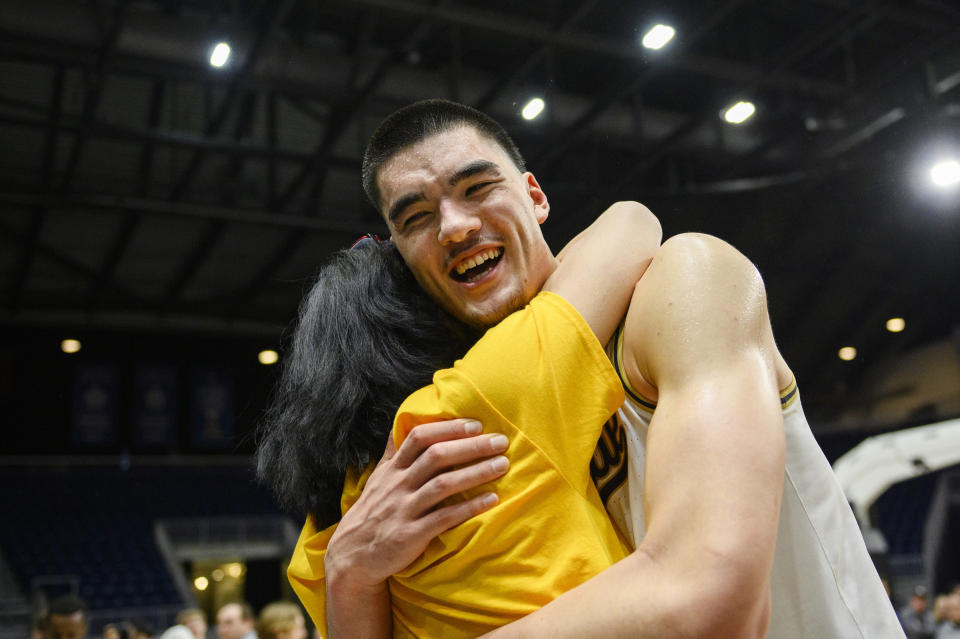 FILE - Purdue center Zach Edey (15) celebrates with his mother after Purdue defeated Alabama 92-86 in an NCAA college basketball game in Toronto, Saturday, Dec. 9, 2023. Edey was the unanimous choice as AP All-Big Ten player of the year in voting released Tuesday, March 12, 2024. (Christopher Katsarov/The Canadian Press via AP, File)