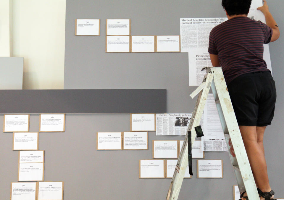 Visual artist Dahlia Osman piecing together the exhibition on 9 July, 2019. (PHOTO: Yahoo News Singapore)