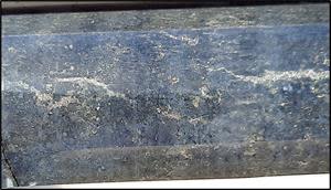 Hole KD902 at approximately 103.52 m, showing disseminated and stringer sulphides. Spot assays of sulphide with pXRF yielded 0.79% Ni and 0.21% Cu.