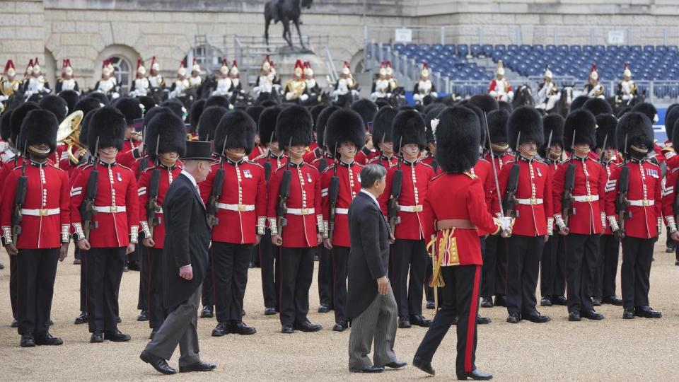 Japans Emperor Naruhito, escorted by Britain's King Charles III