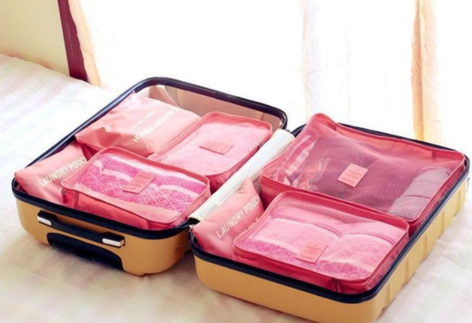 A suitcase packed neatly using the oxford travel organiser set