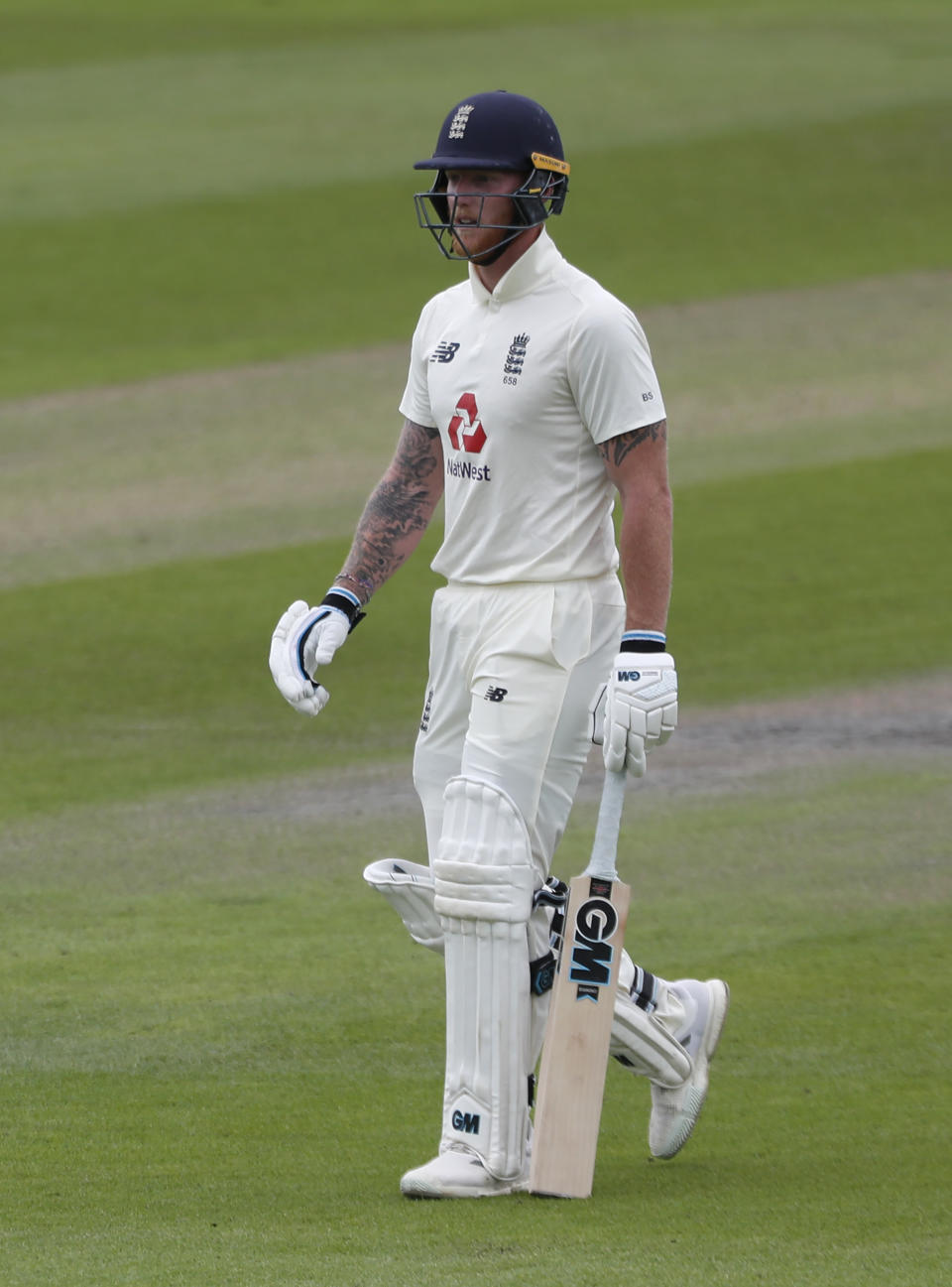 England's Ben Stokes walks off the field after being dismissed by Pakistan's Yasir Shah during the fourth day of the first cricket Test match between England and Pakistan at Old Trafford in Manchester, England, Saturday, Aug. 8, 2020. (Lee Smith/Pool via AP)