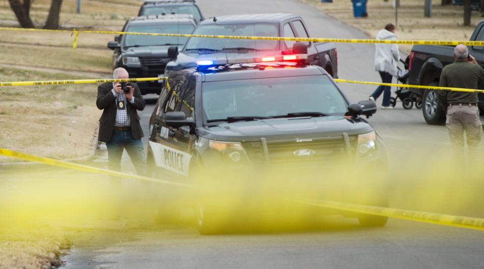 Investigators work the scene of a deadly shooting on Tuesday in Joplin, Missouri.