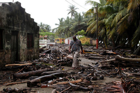 A man walks among debris as Hurricane Irma moves off the northern coast of the Dominican Republic, in Nagua, Dominican Republic, September 7, 2017. REUTERS/Ricardo Rojas