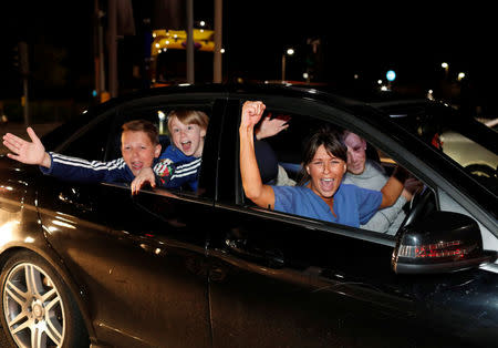 Leicester City fans celebrate outside the King Power stadium after their team won the Premier League title in Leicester, Britain May 2, 2016. REUTERS/Eddie Keogh