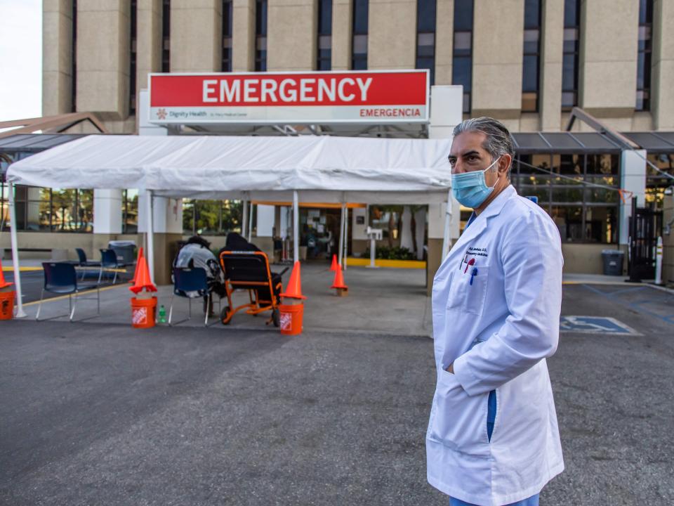 Doctor Ali Jamehdor, Chief Director of the Emergency Room of the Dignity Health - St. Mary Medical Center, stands in front of a Covid-19 triage tent for patients with symptoms in Long Beach, California, on December 17, 2020. - Over the last two weeks, the number of new Covid-19 cases in 24 hours has climbed above 200,000 for 11 out of 14 days. Experts now fear the situation will become even more dire following end of year celebrations, including the Christmas holiday. (Photo by Apu GOMES / AFP) (Photo by APU GOMES/AFP via Getty Images)