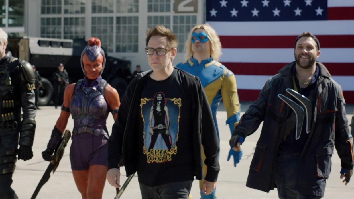  James Gunn walking with The Suicide Squad actors. 