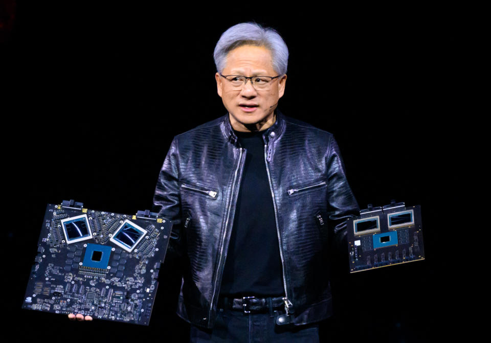 NVIDIA's CEO Jensen Huang shows off products on stage during the annual Nvidia GTC Artificial Intelligence Conference at the SAP Center in San Jose, California, on March 18, 2024. (Photo by JOSH EDELSON/AFP) (Photo by JOSH EDELSON/AFP via Getty Images )