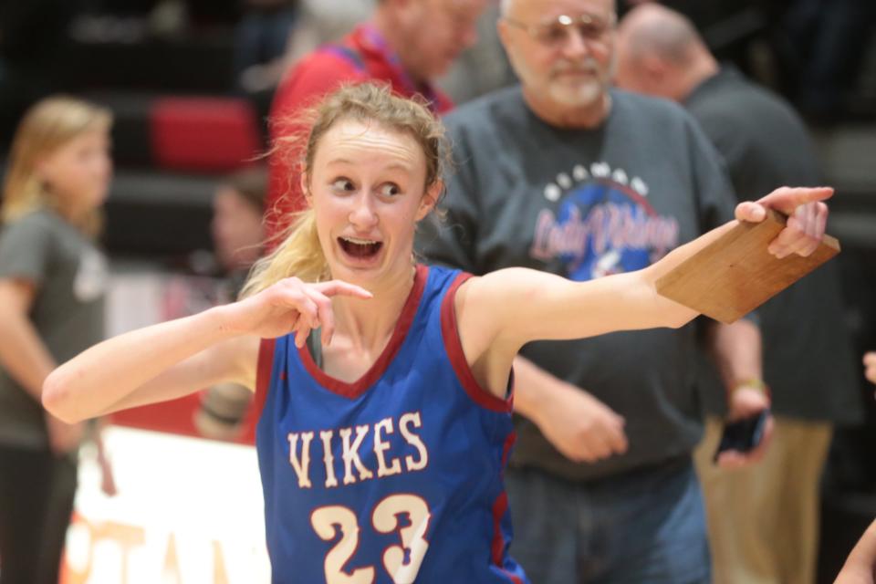 Seaman sophomore Anna Becker (23) reacts after being awarded the Glacier's Edge Tournament MVP player plaque Saturday at Emporia High School.