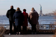 <p>People look toward the Statue of Liberty from Battery Park following a U.S. government shutdown in Manhattan, Jan. 20, 2018. (Photo: Andrew Kelly/Reuters) </p>