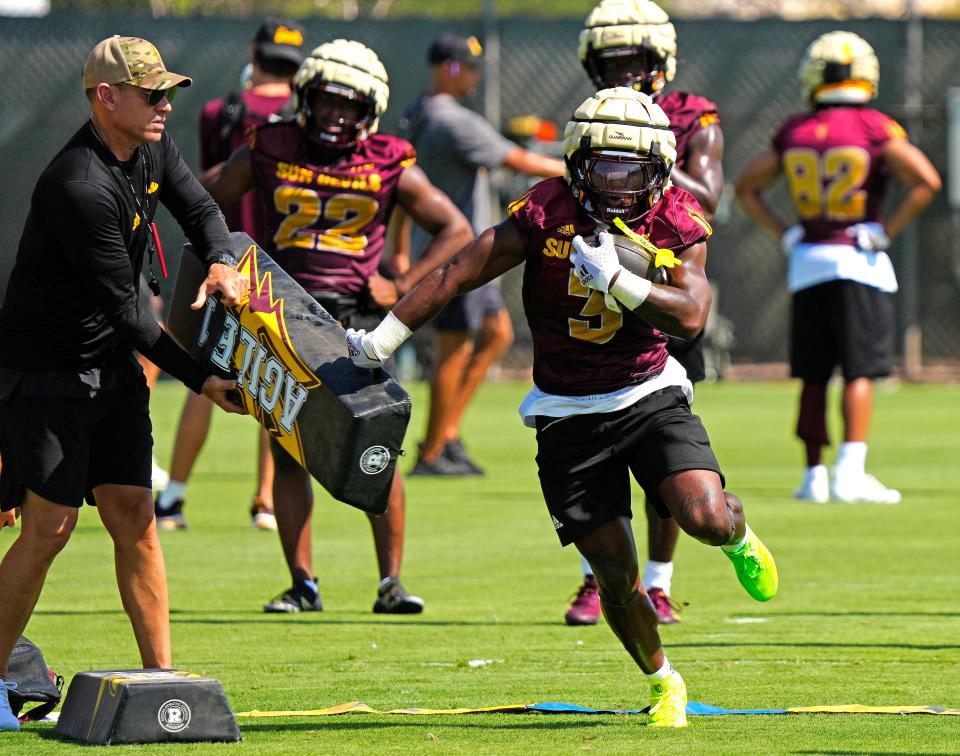 ASU running back Raleek Brown (3) runs a drill during practice in Tempe on July 31, 2024.