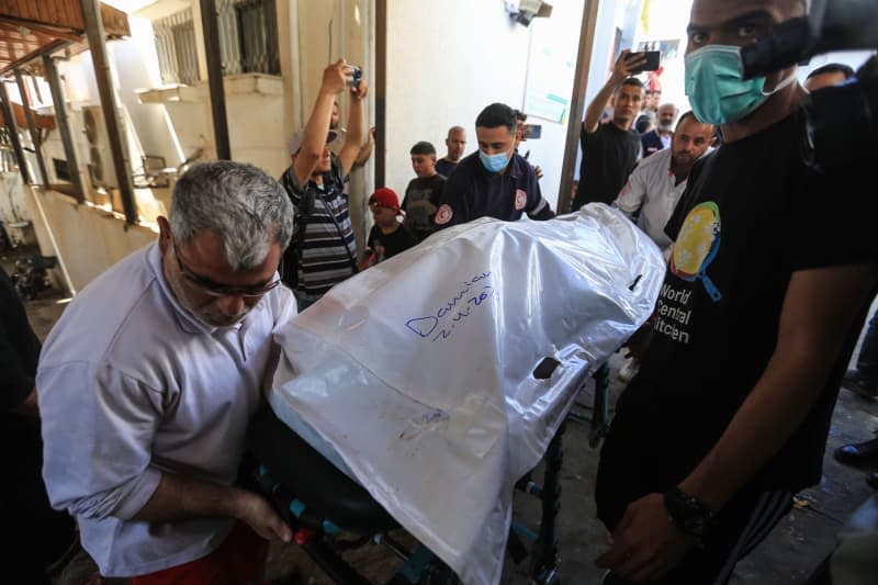 Members of the World Central Kitchen aid group, transports the body of one of the staff members who were killed in an Israeli air strike, out of the morgue of Abu Youssef Al-Najjar Hospital in Rafah in the southern Gaza Strip. Seven employees of the US-based aid organization World Central Kitchen (WCK) were killed in an Israeli airstrike on the Gaza Strip on Monday. Mohammed Talatene/dpa