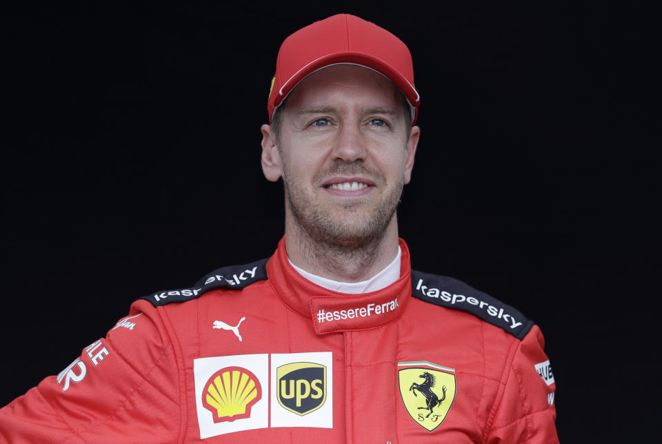 In this picture taken March 12, 2020 Ferrari driver Sebastian Vettel of Germany poses for a photo at the Australian Formula One Grand Prix in Melbourne. Four-time Formula One champion Sebastian Vettel will leave Ferrari at the end of the year, the Italian team said Tuesday, May 12, 2020. Ferrari said the decision was by mutual consent. (AP Photo/Rick Rycroft)