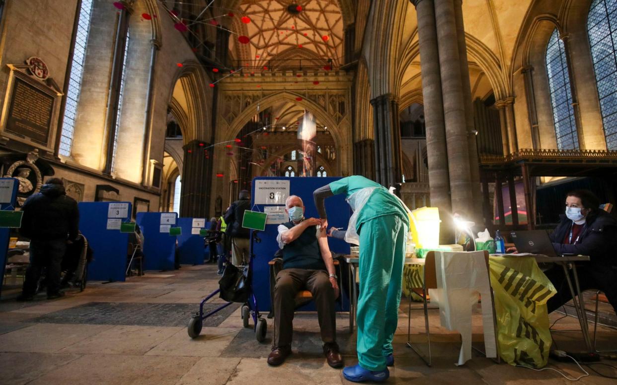 Former RAF Flight Sergeant Louis Godwin receives the Pfizer coronavirus vaccine at Salisbury Cathedral, Wiltshire - Steve Parsons/PA