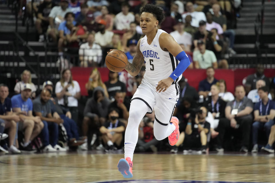 Orlando Magic's Paolo Banchero brings the ball up against the Houston Rockets during the first half an NBA summer league basketball game Thursday, July 7, 2022, in Las Vegas. (AP Photo/John Locher)