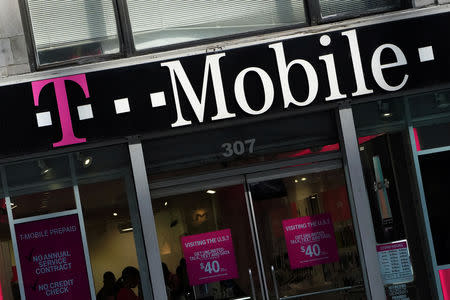 FILE PHOTO: A T-Mobile store is pictured in the Manhattan borough of New York, New York, U.S., May 20, 2019. REUTERS/Carlo Allegri/File Photo