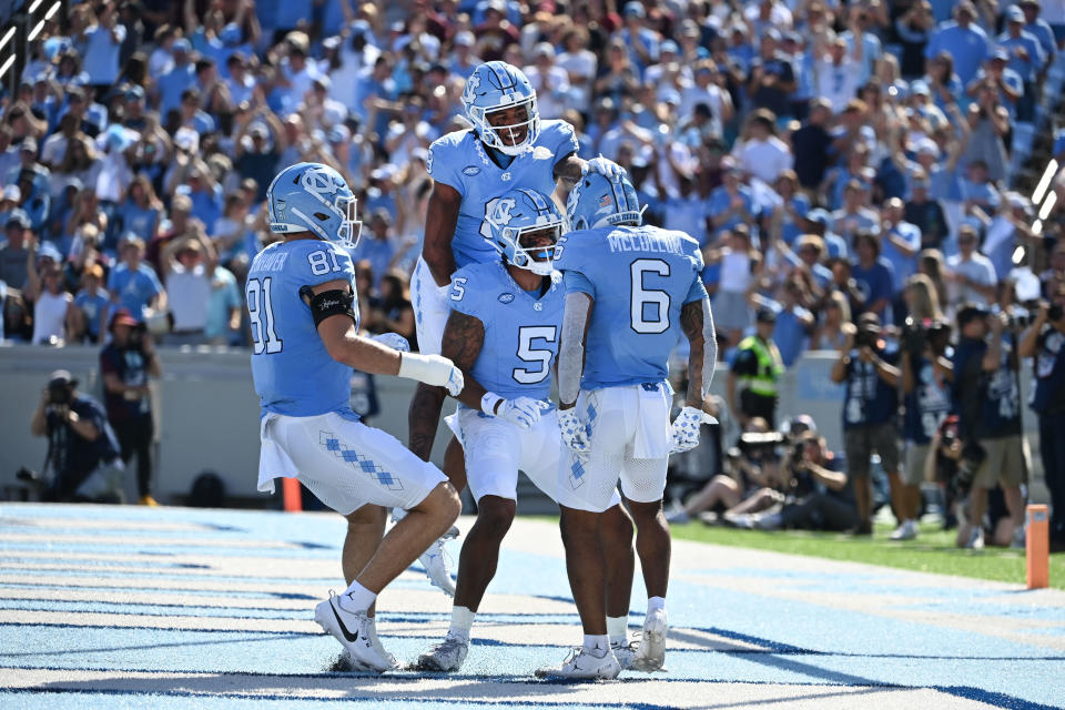 Sep 16, 2023; Chapel Hill, North Carolina, USA; North Carolina Tar Heels wide receiver Nate McCollum (6) celebrates with teammates after scoring a touchdown in the first quarter at Kenan Memorial Stadium. Mandatory Credit: Bob Donnan-USA TODAY Sports