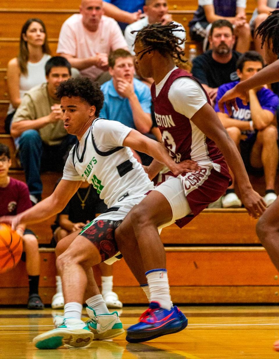 Skylar Strickland pushes his way towards the hoop with Elijah Mobley, of Western Ranch trying to block during the Six-County All-Star Basketball Game at Modesto Junior College in Modesto, Calif., Saturday, April 29, 2023.