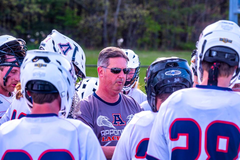 Apponequet Head Coach Jeremy Nodelman speaks to the team during a timeout.