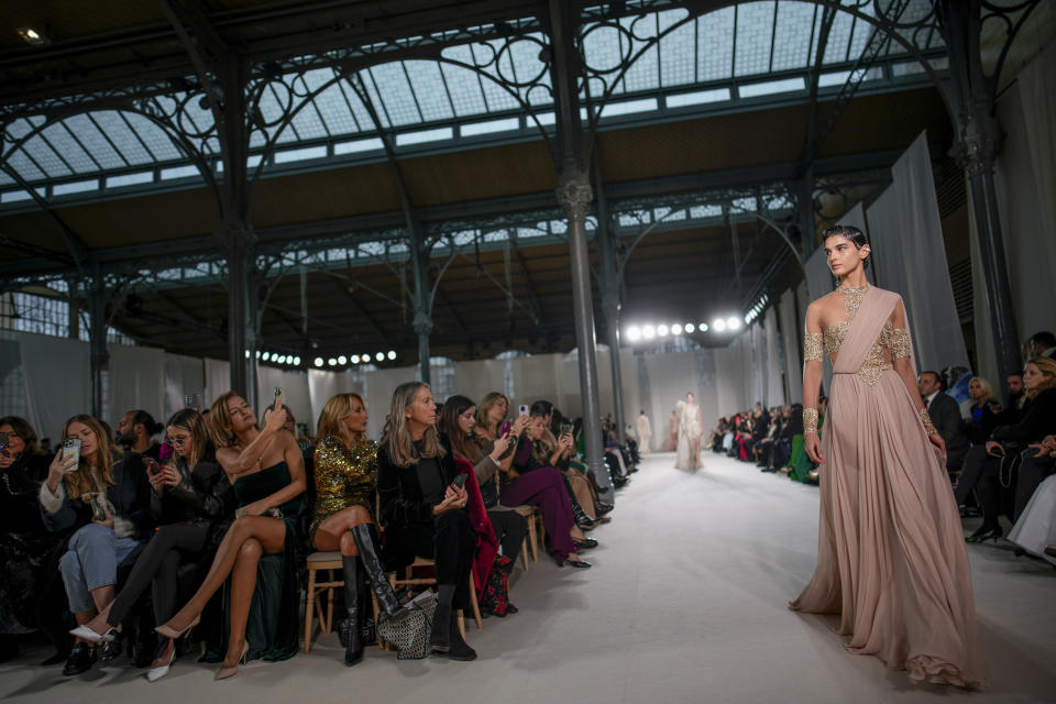 A model wears a creation as part of the Elie Saab Haute Couture Spring-Summer 2023 collection presented in Paris, Wednesday, Jan. 25, 2023. (AP Photo/Christophe Ena)